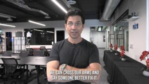 dean graziosi office crossed arms