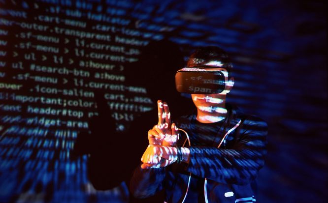 cyber-attack-with-unrecognizable-hooded-hacker-using-virtual-reality-digital-glitch-effect
